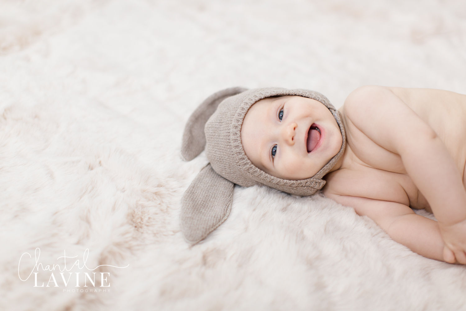 baby-boy-bunny-smiles-studio-portrait